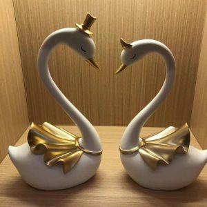 white swan with luxurious gold accents. 2pcs