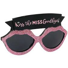 Bachelorette party glasses decorated with the phrase "Kiss the Miss Goodbye"